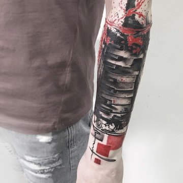 Tatuaż na nadgarstku męski w stylu abstrakcyjnym z czarno-czerwonymi elementami geometrycznymi