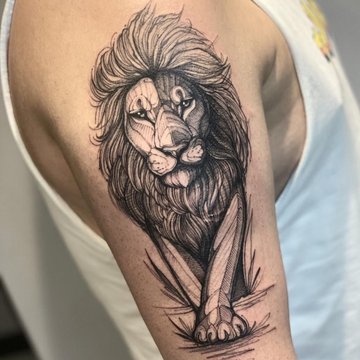 Tatuaż na barku męski - lew w stylu linework