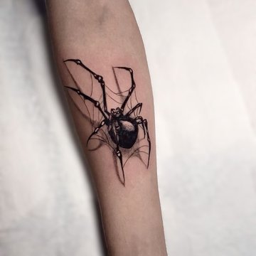 Tatuaż realistycznego pająka na ręce
