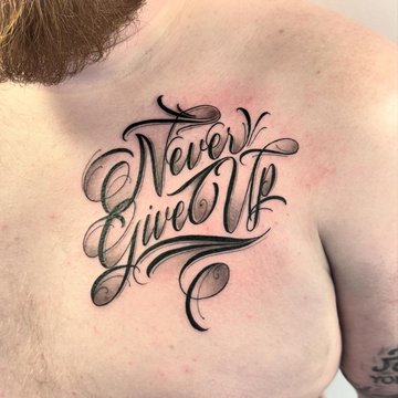 Napis Never Give Up z cieniem
