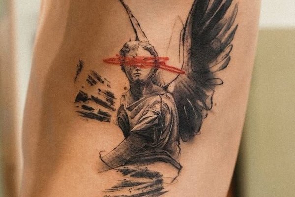 Tatuaż anioł na żebrach męski